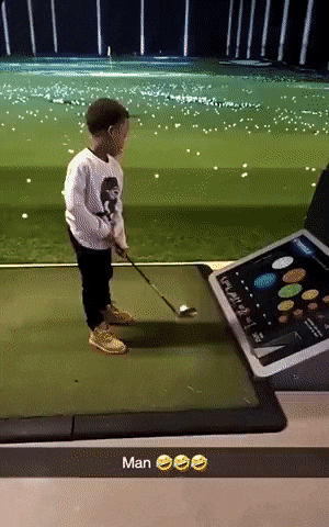 Boy playing golf