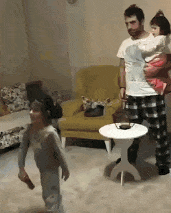 Dad playing with his daughters