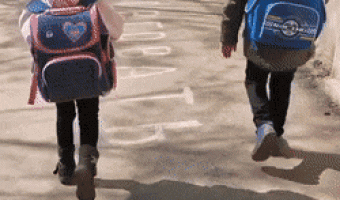Children walking with bags